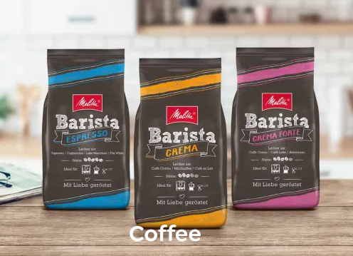 Melitta® coffee Coffee Bags next to each other on wooden table in kitchen